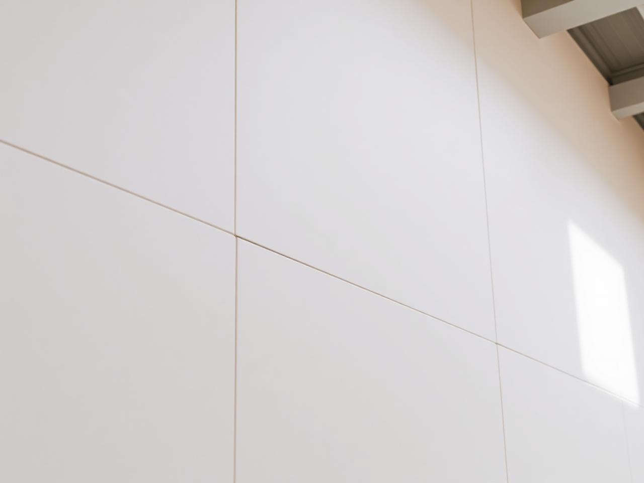 Seamless taped and jointed plasterboard wall in a commercial interior